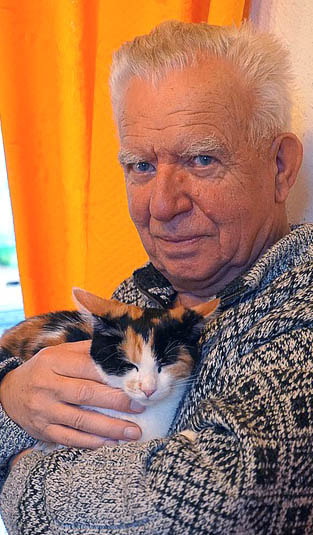 Senior Holding Tabby Cat Picture